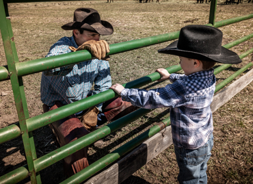 Photo of cowboy and his son.